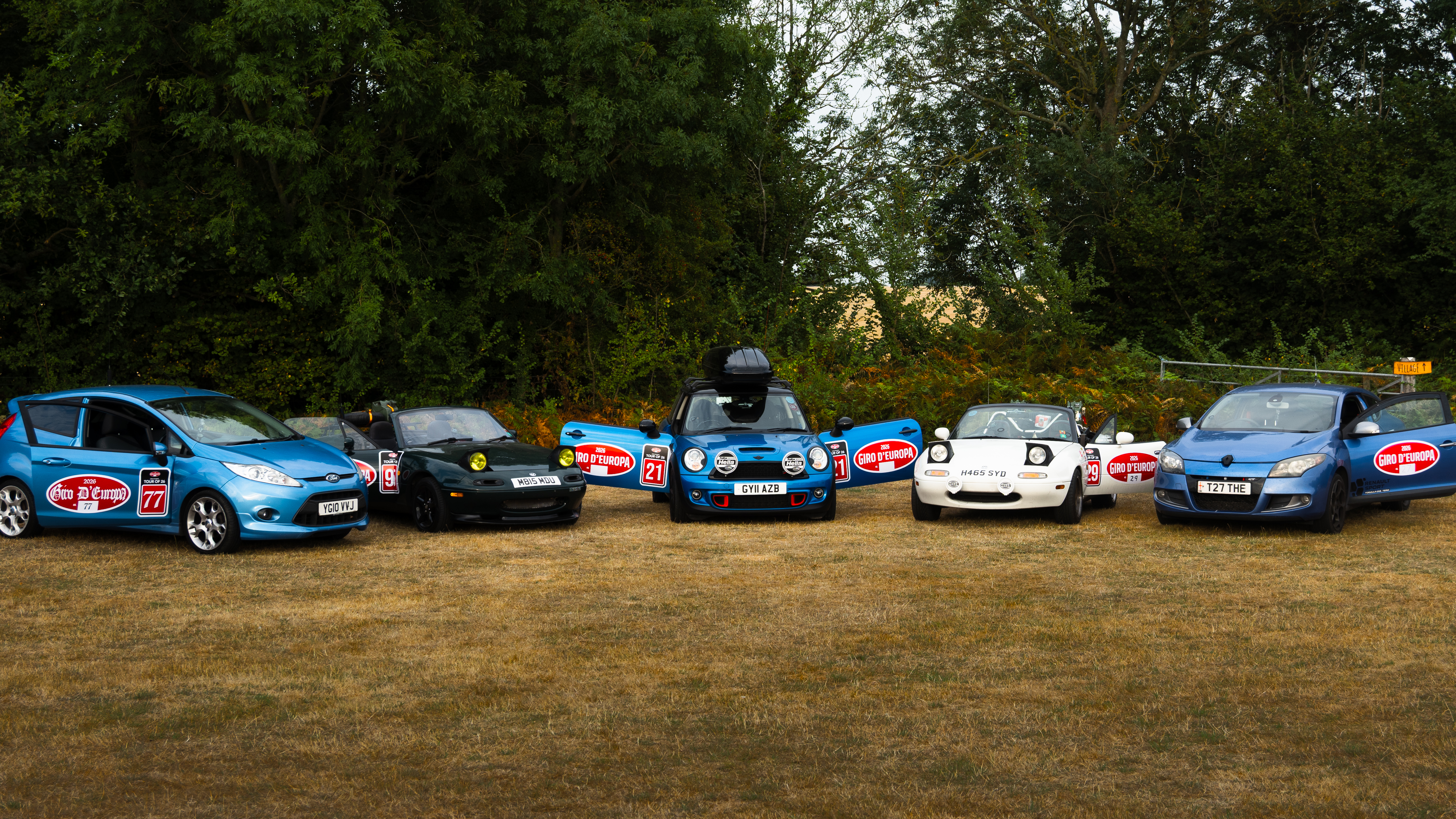 Members and cars on a European road trip